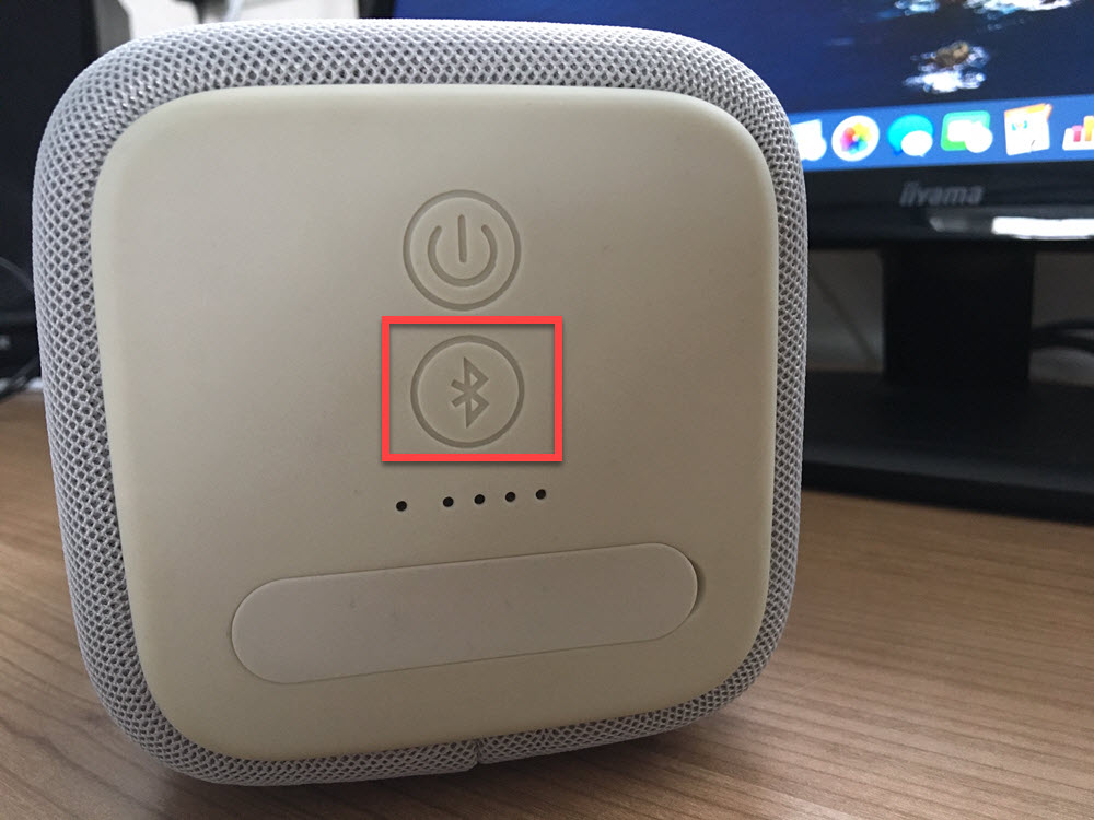 Bluetooth logo on a wireless speaker